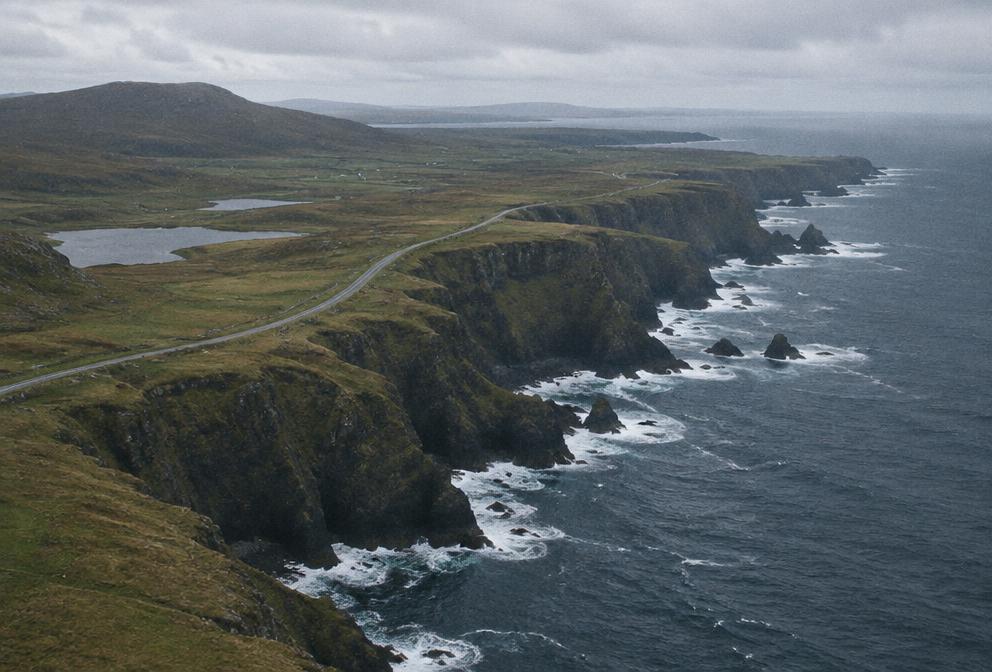 Aerial view of a rugged coastline and coastal road
